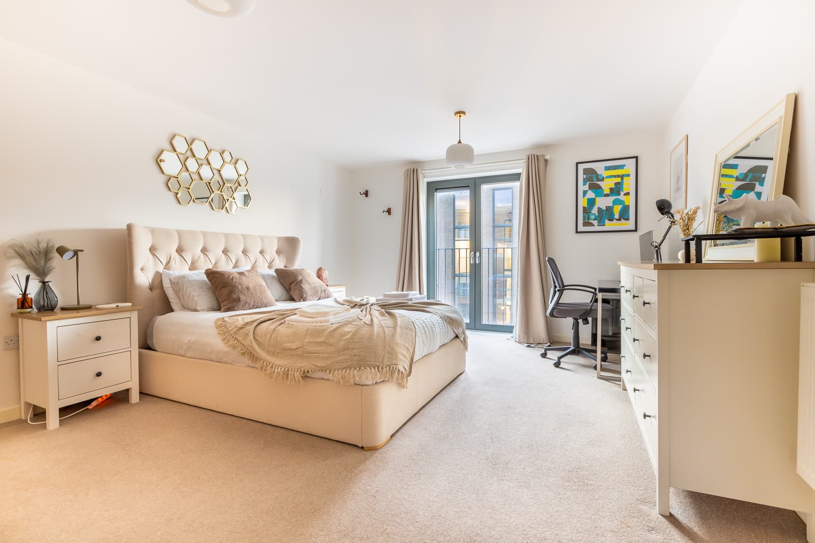 Warm, calm bedroom in a serviced apartment we operate