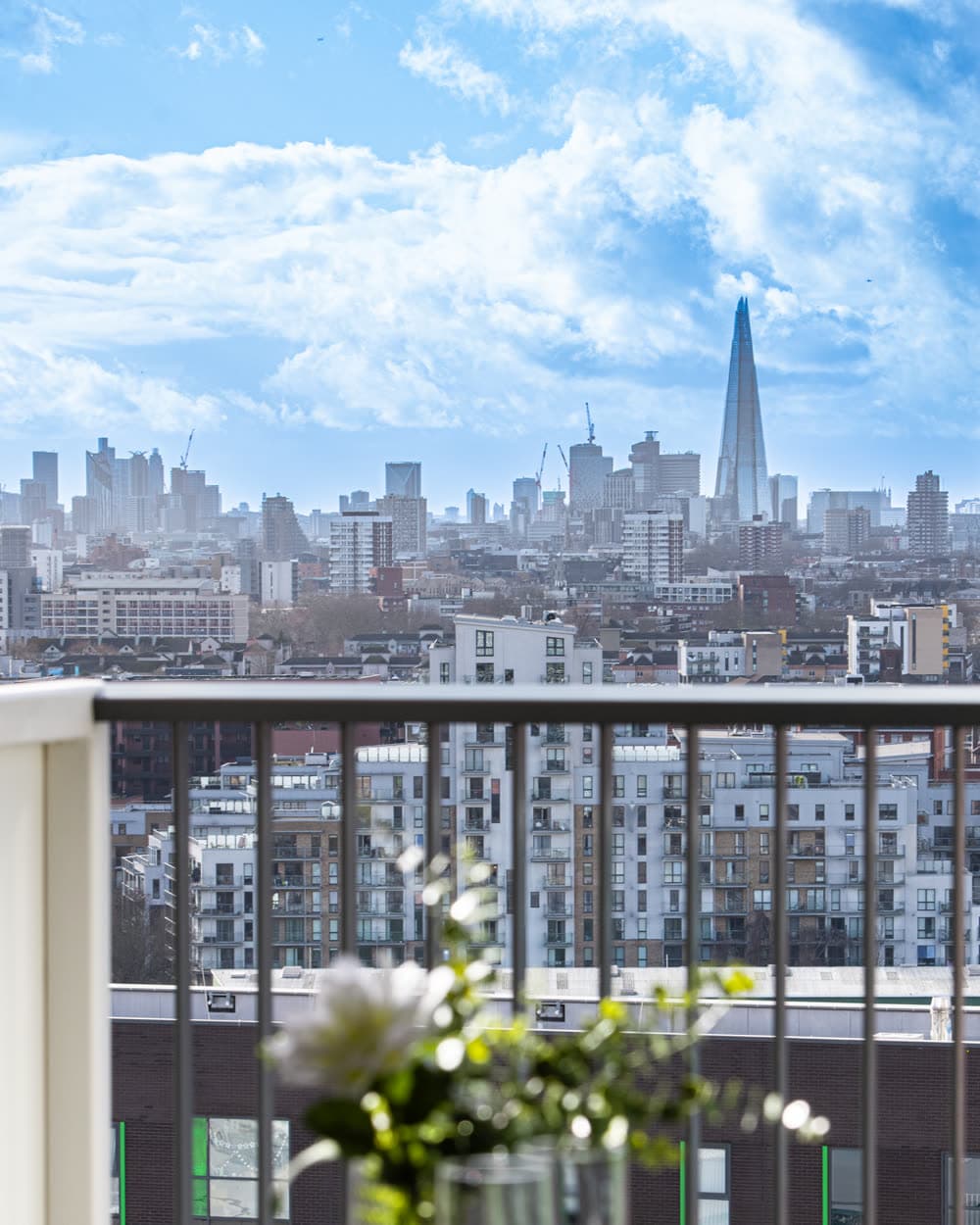 The London skyline seen from the balcony of an apartment we operate
